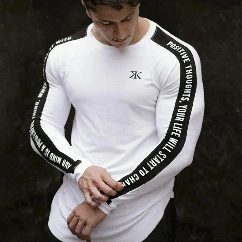 Men's long sleeve white t-shirt with black stripe and positive message.