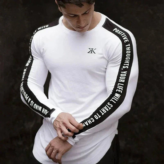 Long sleeve t-shirt with motivational text on sleeves, casual wear.